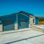 Hillside mid century modern home driveway drainage Austin Tx by Vintage Modern Design Build