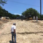 driveway drainage water diversion new home build hillside austin tx