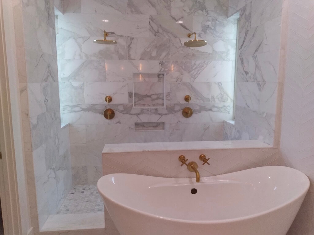 Calacatta Gold Walk in Shower Remodeling Project in Austin TX by Vintage Modern Design Build - Kitchen & Bathroom Remodeling in Austin TX