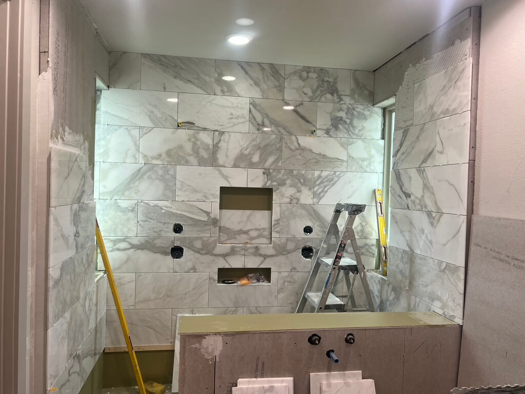 Calacatta Gold Walk in Shower Remodeling Project in Austin TX by Vintage Modern Design Build - Kitchen & Bathroom Remodeling in Austin TX