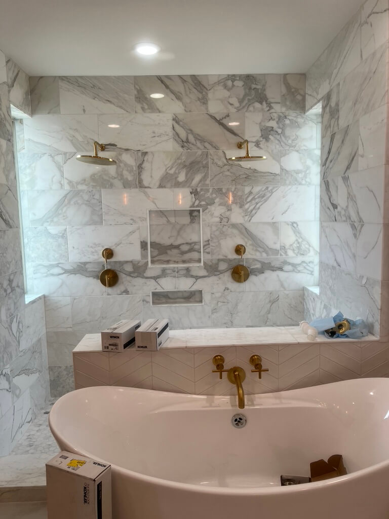 Calacatta Gold Walk in Shower Remodeling Project in Austin TX by Vintage Modern Design Build - Kitchen & Bathroom Remodeling in Austin TX
